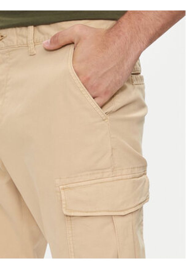 Tommy Jeans Spodnie materiałowe Austin DM0DM19489 Beżowy Regular Fit. Kolor: beżowy. Materiał: bawełna