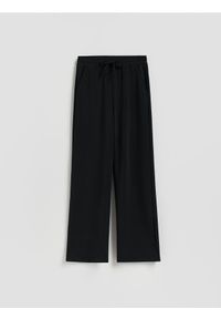 Reserved - Spodnie dresowe long leg - czarny. Kolor: czarny. Materiał: dresówka