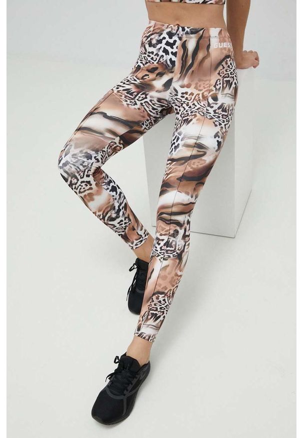 Guess legginsy damskie kolor brązowy wzorzyste. Stan: podwyższony. Kolor: brązowy. Materiał: włókno, materiał