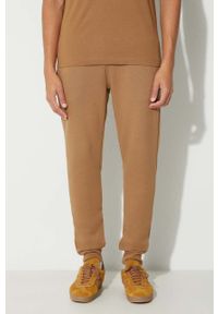 Lacoste spodnie dresowe męskie kolor brązowy gładkie. Kolor: brązowy. Materiał: dresówka. Wzór: gładki #3