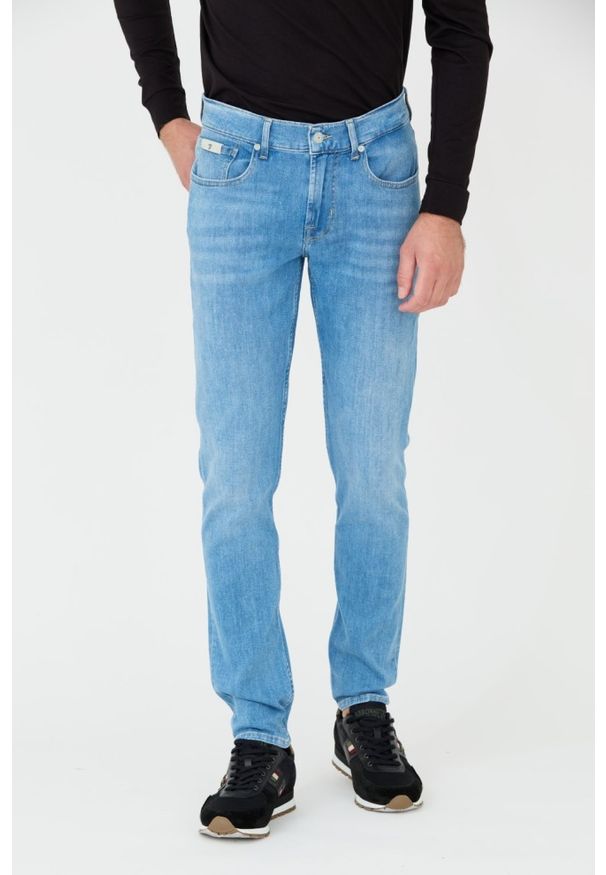 7 FOR ALL MANKIND Niebieskie męskie jeansy Slimmy Tapered, Rozmiar 34. Kolor: niebieski