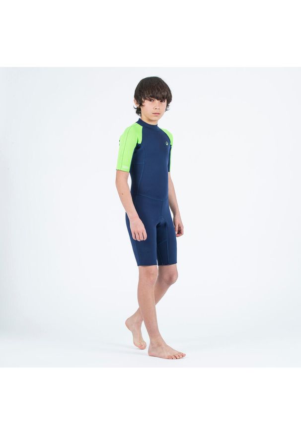 Decathlon - Krótka pianka surfingowa dla dzieci Olaian 100 YULEX® z neoprenu 1,5 mm. Kolor: niebieski, wielokolorowy, zielony. Materiał: poliester, kauczuk, materiał. Długość: krótkie