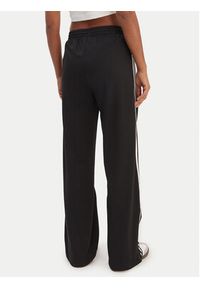 Adidas - adidas Spodnie dresowe Firebird KD7976 Czarny Loose Fit. Kolor: czarny. Materiał: syntetyk #5