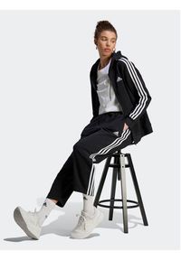 Adidas - adidas Spodnie dresowe Essentials 3-Stripes Open Hem Fleece HZ5748 Czarny Loose Fit. Kolor: czarny. Materiał: bawełna #6