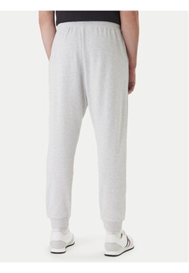 TOMMY HILFIGER - Tommy Hilfiger Spodnie dresowe UM0UM03664 Szary Regular Fit. Kolor: szary. Materiał: syntetyk, bawełna