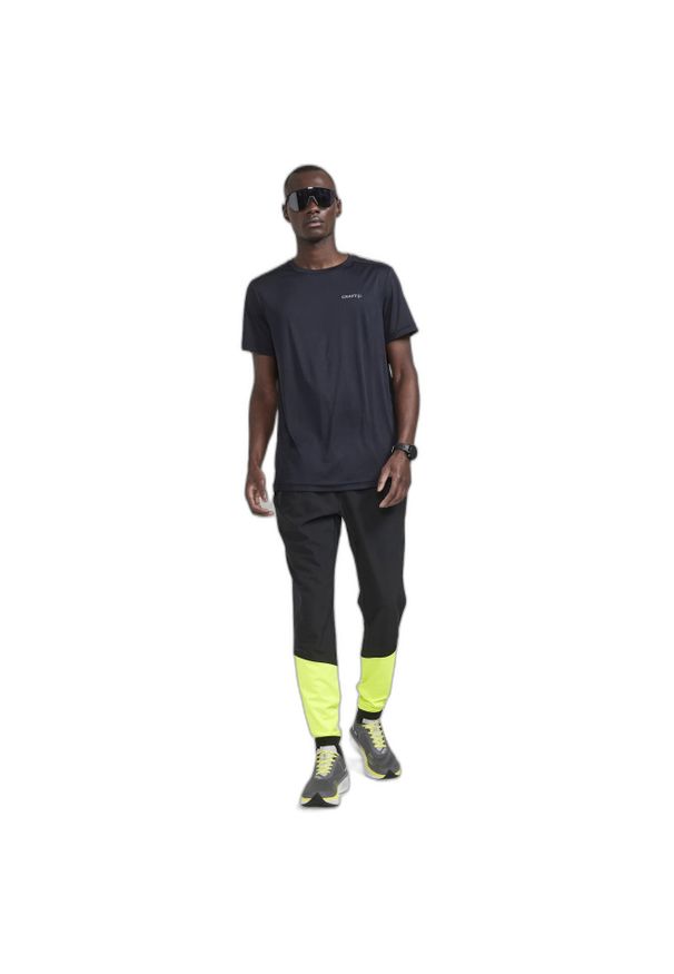 Spodnie do biegania Craft Adv Essence. Kolor: żółty, wielokolorowy, czarny. Sport: bieganie, fitness