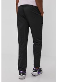 Puma Spodnie 586732 męskie kolor czarny gładkie. Kolor: czarny. Materiał: tkanina, materiał. Wzór: gładki #3