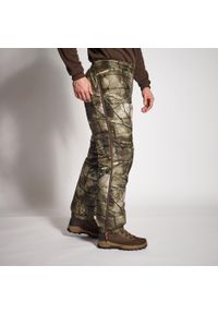 SOLOGNAC - Spodnie zimowe myśliwskie Solognac camo treemetic. Kolor: zielony, brązowy, wielokolorowy. Materiał: materiał. Sezon: zima. Sport: outdoor
