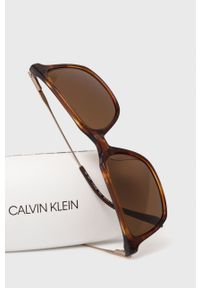 Calvin Klein Okulary przeciwsłoneczne męskie kolor brązowy. Kolor: brązowy