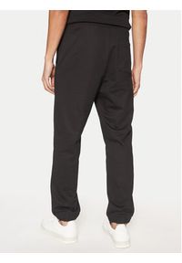 Hugo - HUGO Spodnie dresowe Dilbero 50530435 Czarny Relaxed Fit. Kolor: czarny. Materiał: bawełna