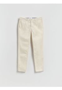 Reserved - Spodnie chino slim fit - złamana biel. Materiał: tkanina, bawełna