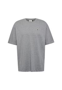 Luźna koszulka Hummel Bee. Typ kołnierza: polo. Kolor: szary. Materiał: bawełna. Wzór: haft, aplikacja #1