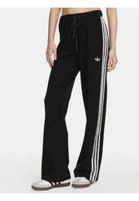 Adidas - adidas Spodnie dresowe Firebird KS9363 Czarny Regular Fit. Kolor: czarny. Materiał: syntetyk #1