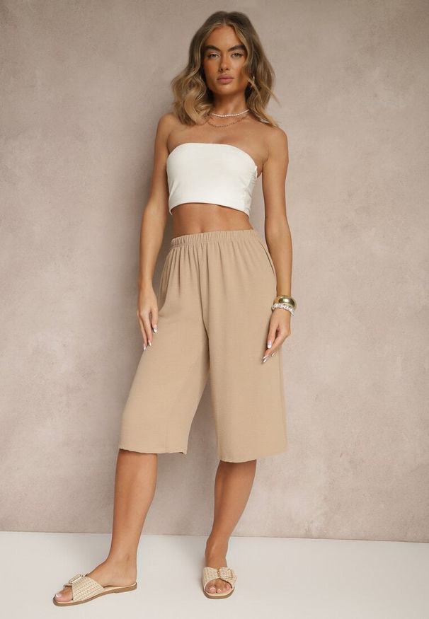Renee - Beżowe Luźne Spodnie 3/4 z Kieszonkami Efrinea. Okazja: na co dzień. Kolor: beżowy. Materiał: guma. Styl: elegancki, casual