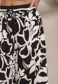 Renee - Czarne Spodnie o Szerokim Kroju High Waist w Kwiaty Nelrive. Okazja: na co dzień, na spacer. Stan: podwyższony. Kolor: czarny. Wzór: kwiaty. Styl: klasyczny, casual, elegancki