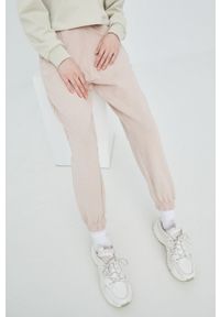 Karl Kani spodnie dresowe bawełniane kolor różowy gładkie. Stan: podwyższony. Kolor: różowy. Materiał: bawełna, dresówka. Wzór: gładki #7