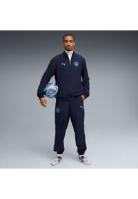 Puma - Dres Manchester City Woven 2025/26. Kolor: niebieski. Materiał: dresówka. Sport: piłka nożna #2