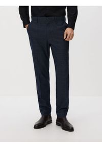 Reserved - Spodnie garniturowe slim fit - granatowy. Kolor: niebieski. Materiał: tkanina #1