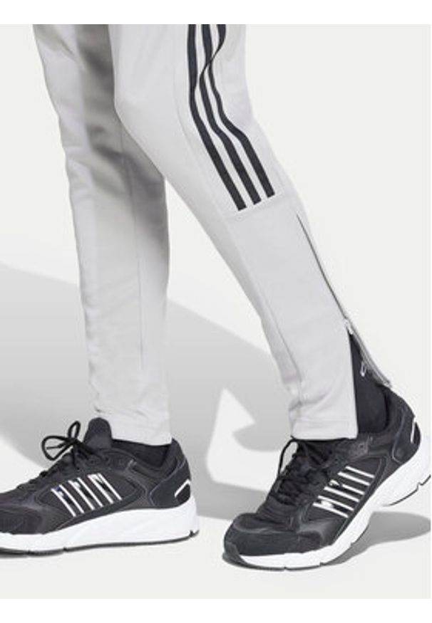 Adidas - adidas Spodnie dresowe Tiro IY4288 Szary Regular Fit. Kolor: szary. Materiał: syntetyk, bawełna