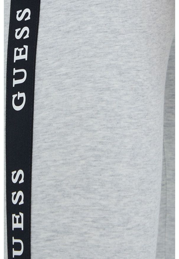 Guess Legginsy damskie kolor szary z aplikacją. Kolor: szary. Materiał: dzianina. Wzór: aplikacja