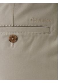 Calvin Klein Chinosy LV04LE612G Beżowy Tapered Fit. Kolor: beżowy. Materiał: bawełna #4