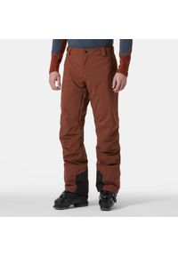Spodnie narciarskie Helly Hansen Legendary. Kolor: pomarańczowy. Sezon: zima. Sport: narciarstwo #1
