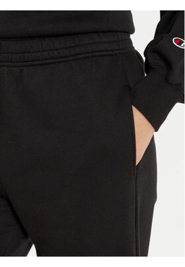 Champion Spodnie dresowe 117583 Czarny Regular Fit. Kolor: czarny. Materiał: bawełna