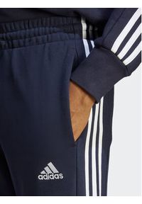 Adidas - adidas Spodnie dresowe Essentials French Terry Tapered Cuff 3-Stripes Joggers IC9406 Niebieski Regular Fit. Kolor: niebieski. Materiał: bawełna #4