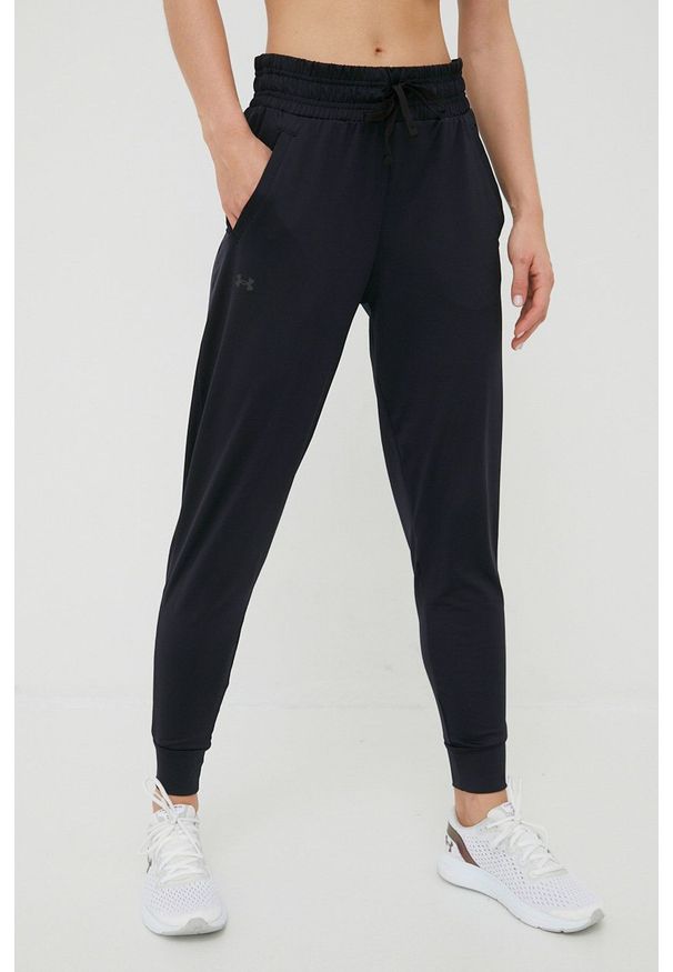Under Armour spodnie treningowe damskie kolor czarny gładkie. Kolor: czarny. Materiał: materiał, skóra. Wzór: gładki