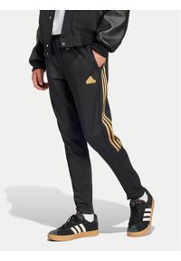 Adidas - adidas Spodnie dresowe House of Tiro Nations IW8865 Czarny Regular Fit. Kolor: czarny. Materiał: bawełna