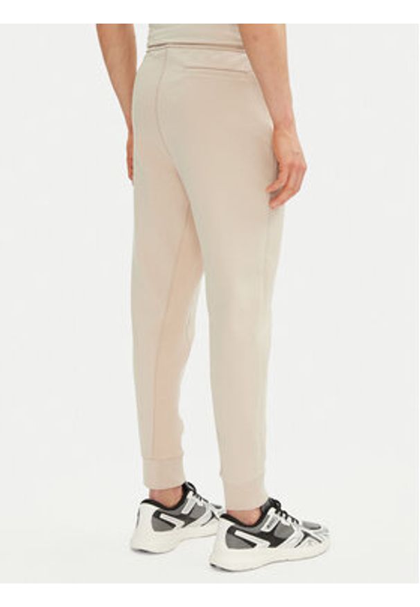 BOSS Spodnie dresowe Hadiko 50537198 Beżowy Regular Fit. Kolor: beżowy. Materiał: bawełna
