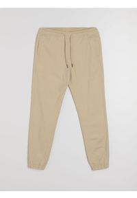 Sinsay - Bawełniane spodnie jogger - beżowy. Kolor: beżowy. Materiał: bawełna #1