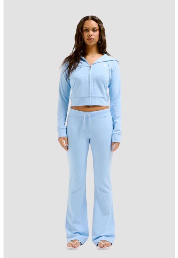 Juicy Couture - JUICY COUTURE Błękitne damskie spodnie dresowe Single Jersey Apollo Low Rise. Kolor: niebieski. Materiał: dresówka, jersey