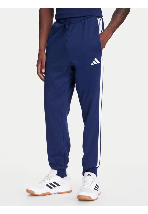 Adidas - adidas Spodnie dresowe Essentials 3-Stripes JD1859 Niebieski Regular Fit. Kolor: niebieski. Materiał: syntetyk