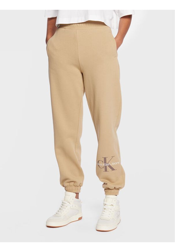 Spodnie dresowe Calvin Klein Jeans. Kolor: beżowy. Materiał: bawełna, dresówka