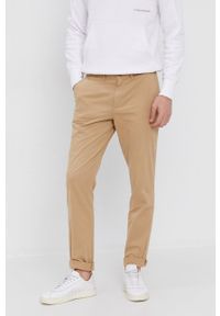 Calvin Klein Jeans - Spodnie. Kolor: beżowy. Materiał: tkanina