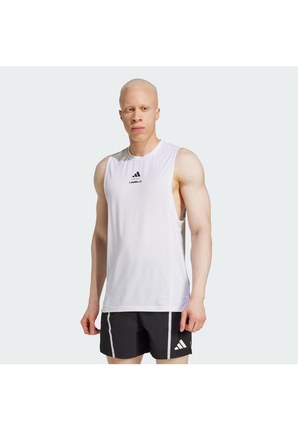 Adidas - Koszulka Les Mills Graphic Tank. Kolor: biały. Długość rękawa: bez rękawów. Technologia: ClimaCool (Adidas). Sport: fitness