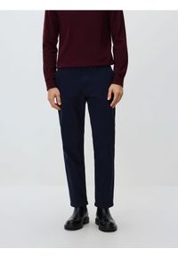 Reserved - Spodnie joggery - granatowy. Kolor: niebieski. Materiał: bawełna #1