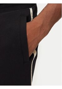 EA7 Emporio Armani Spodnie dresowe 7M000974 AF10377 UC001 Czarny Regular Fit. Kolor: czarny. Materiał: bawełna #3