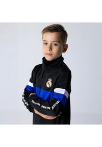 Dres piłkarski dziecięcy Real Madrid 24/25. Kolor: czarny. Materiał: dresówka. Styl: młodzieżowy, sportowy #1