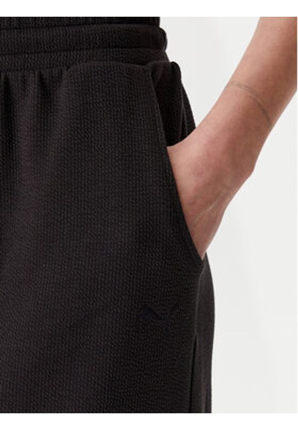 Puma Spódnica midi Her 685059 Czarny Regular Fit. Kolor: czarny. Materiał: bawełna