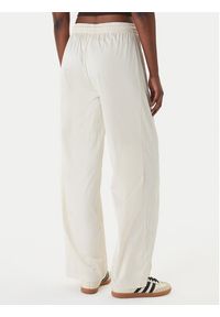 Adidas - adidas Spodnie dresowe Pearl Firebird KE3393 Écru Loose Fit. Kolor: kremowy. Materiał: syntetyk #5