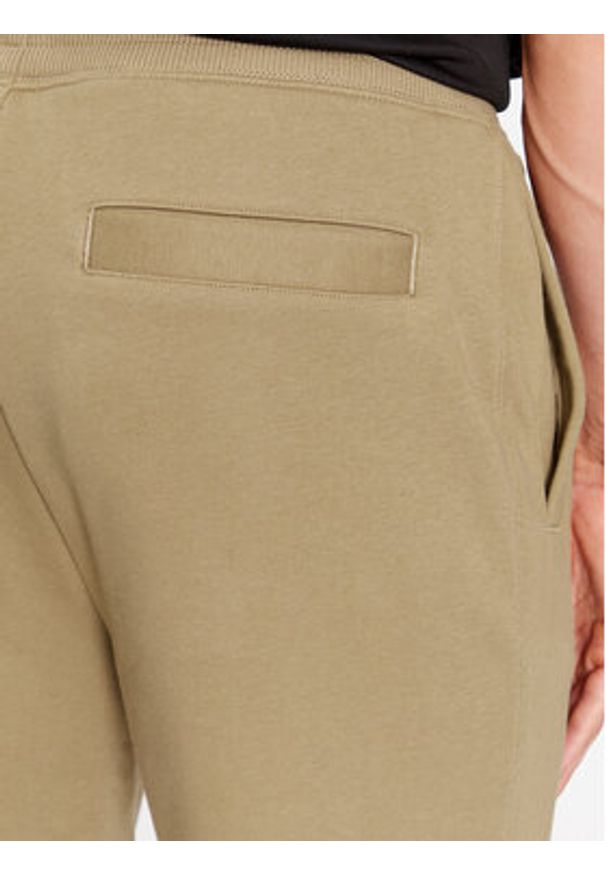 Hugo Spodnie dresowe Drokko 50494571 Brązowy Relaxed Fit. Kolor: brązowy. Materiał: dresówka, bawełna