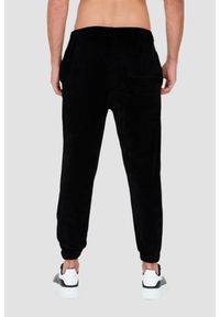 MOSCHINO Czarne welurowe spodnie dresowe. Kolor: czarny. Materiał: dresówka, welur #6