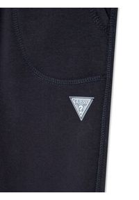 Guess Spodnie dresowe L2BQ15 KBGQ2 Granatowy Regular Fit. Kolor: niebieski. Materiał: bawełna, syntetyk