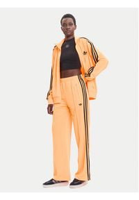 Adidas - adidas Spodnie dresowe adicolor Classic Firebird JY2694 Żółty Loose Fit. Kolor: żółty. Materiał: syntetyk #4