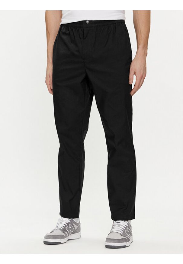 New Balance Spodnie dresowe MP41575 Czarny Regular Fit. Kolor: czarny. Materiał: bawełna