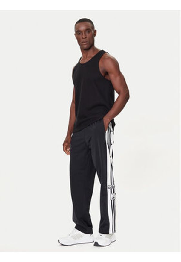 Adidas - adidas Spodnie dresowe Adibreak JP3760 Czarny Regular Fit. Kolor: czarny. Materiał: syntetyk