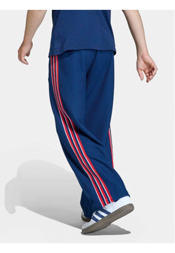 Adidas - adidas Spodnie dresowe Firebird Double Knit KD7825 Granatowy Loose Fit. Kolor: niebieski. Materiał: syntetyk