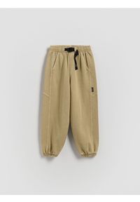Reserved - Dresowe spodnie oversize - oliwkowy. Kolor: oliwkowy. Materiał: dresówka #1